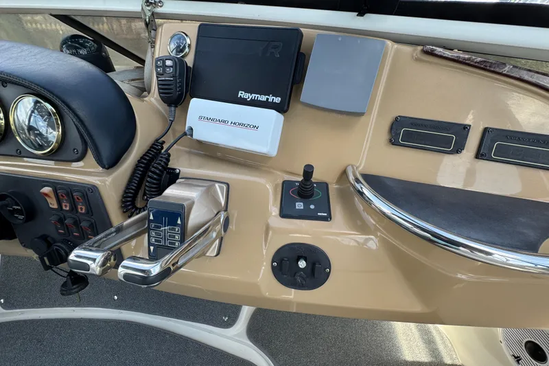 Slide: The Image of Control panel of 2004 Carver 444 Cockpit Motor Yacht with navigation and communication equipment. - 18