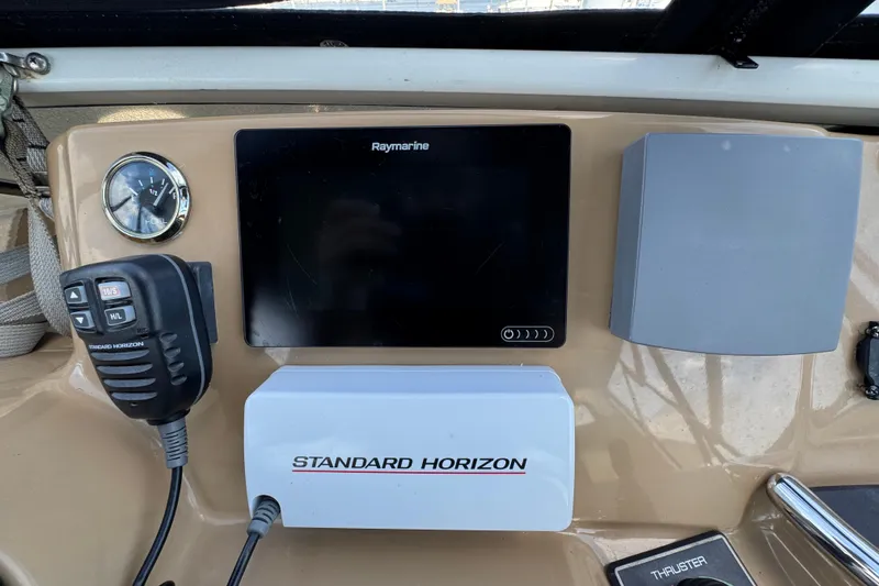 Slide: The Image of Control panel of 2004 Carver 444 Cockpit Motor Yacht with Raymarine and Standard Horizon equipment. - 19