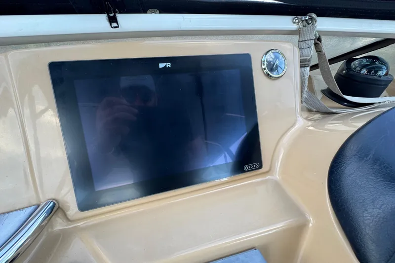 Slide: The Image of Dashboard of 2004 Carver 444 Cockpit Motor Yacht with touchscreen and compass. - 20