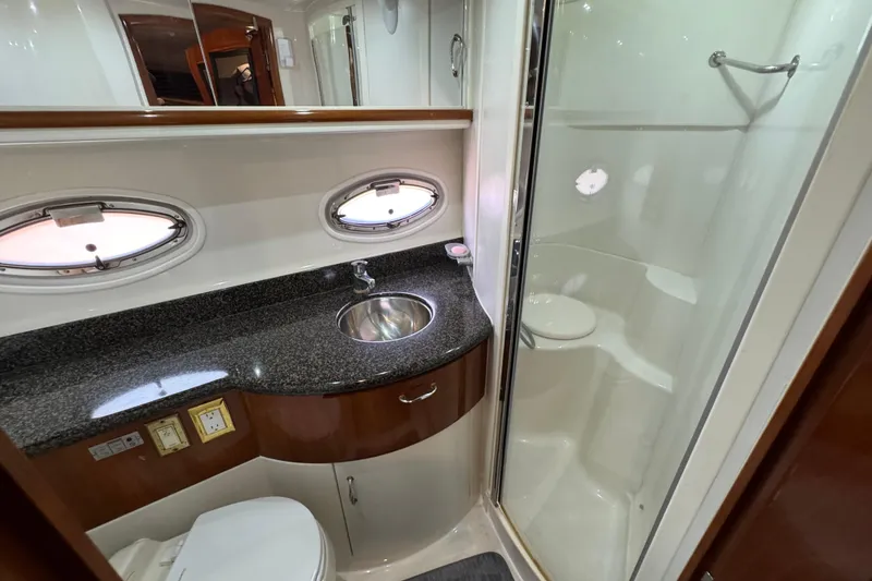 Slide: The Image of Luxurious bathroom in 2004 Carver 444 Cockpit Motor Yacht with shower and granite countertop. - 40
