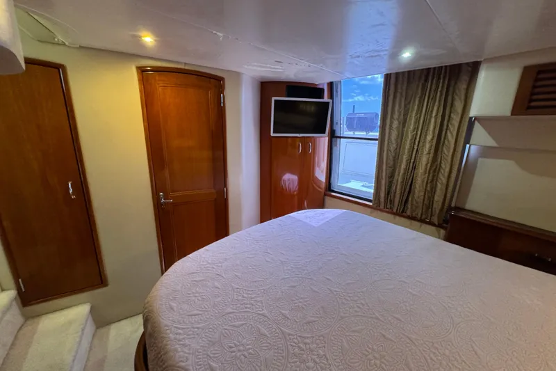 Slide: The Image of Luxurious interior of 2004 Carver 444 Cockpit Motor Yacht with elegant wood finishes. - 41