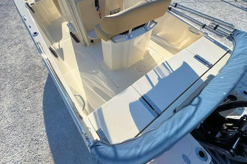 Slide: The Image of 2016 Scout 251 XS boat interior with seating and storage compartments. - 5
