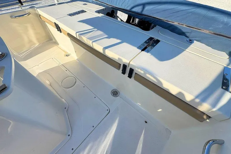 Slide: The Image of 2016 Scout 251 XS boat interior with seating and storage compartments. - 7