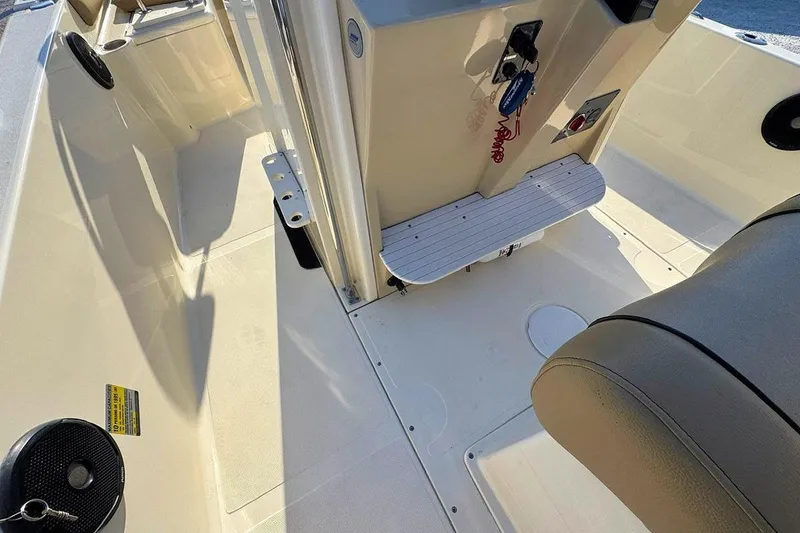 Slide: The Image of 2016 Scout 251 XS boat interior with seating and control panel. - 8
