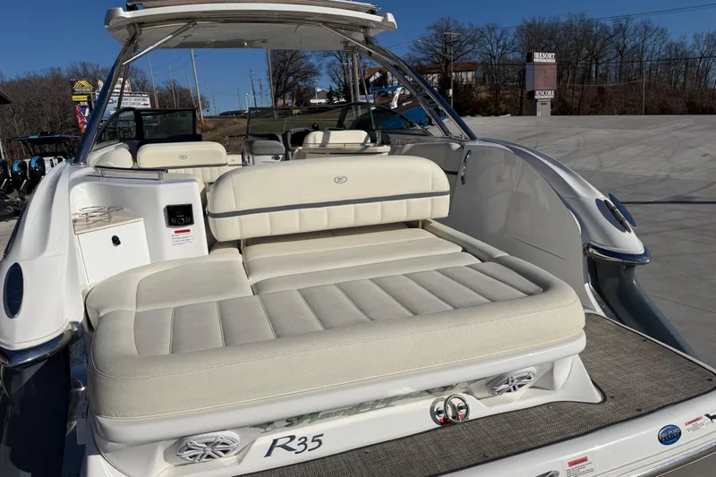 Slide: The Image of 2019 Cobalt R35 boat with spacious white seating and modern design. - 13