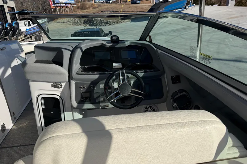 Slide: The Image of Interior view of a 2019 Cobalt R35 boat cockpit with steering wheel and dashboard. - 18