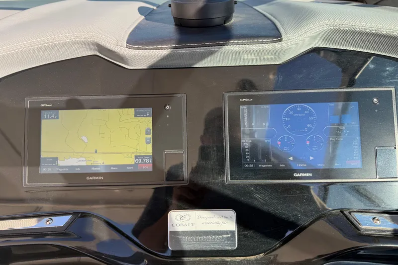 Slide: The Image of Dashboard of a 2019 Cobalt R35 with dual Garmin displays showing navigation and engine data. - 22