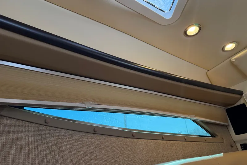 Slide: The Image of Interior view of 2019 Cobalt R35 boat with window and ceiling lights. - 27