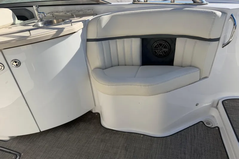 Slide: The Image of 2019 Cobalt R35 boat interior with white seating and built-in speaker. - 30