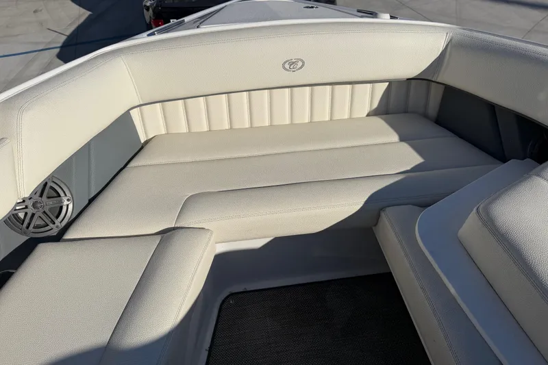 Slide: The Image of 2019 Cobalt R35 boat interior with white cushioned seating and speaker. - 33