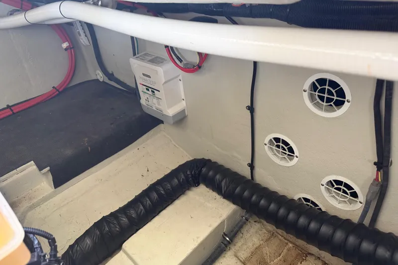 Slide: The Image of Interior of a 2019 Cobalt R35 boat showing wiring and ventilation system. - 43