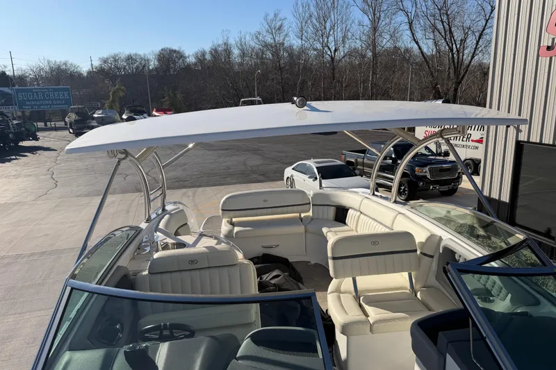 Slide: The Image of 2019 Cobalt R35 boat with spacious seating and sleek design in a parking lot. - 45