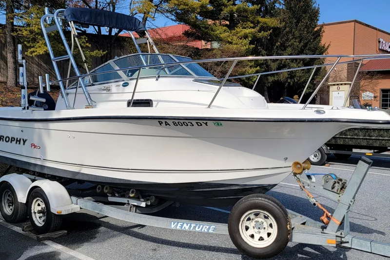 The Image of 2003 Trophy 2002 Walkaround boat on trailer, parked outdoors. - 0