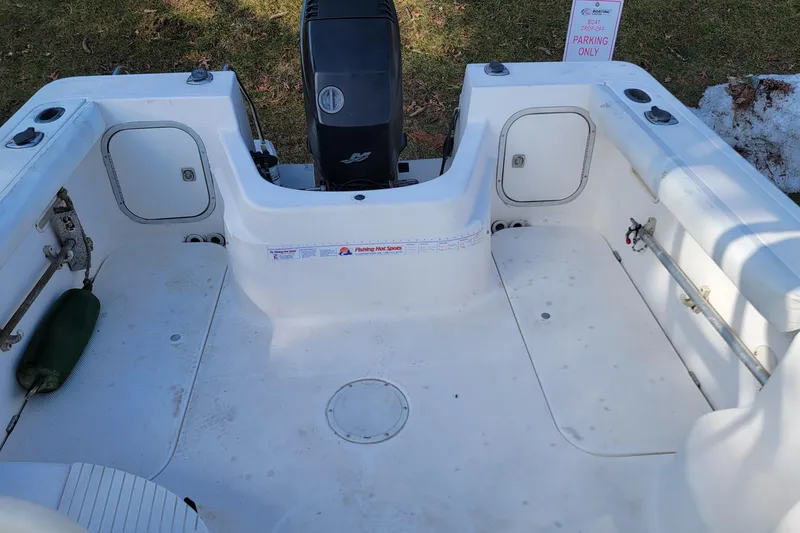 Slide: The Image of 2003 Trophy 2002 Walkaround boat interior with engine and storage compartments. - 10