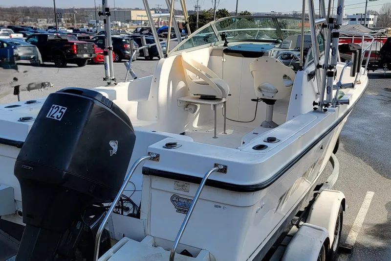 Slide: The Image of 2003 Trophy 2002 Walkaround boat with outboard motor in parking lot. - 4