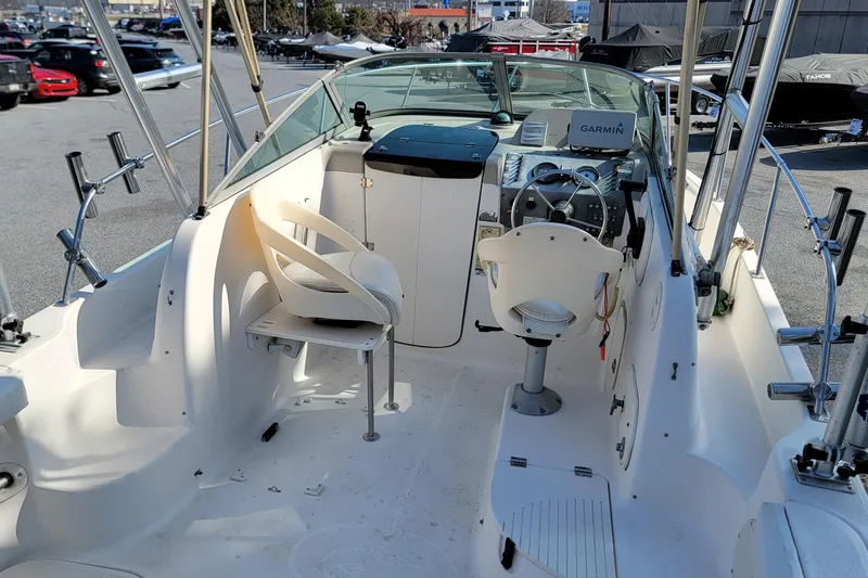 Slide: The Image of 2003 Trophy 2002 Walkaround boat interior with steering console and seating. - 6