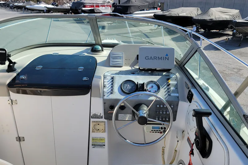 Slide: The Image of 2003 Trophy 2002 Walkaround boat dashboard with Garmin navigation system. - 7