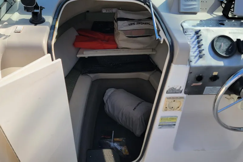 Slide: The Image of 2003 Trophy 2002 Walkaround cabin with life jackets and boating equipment. - 8