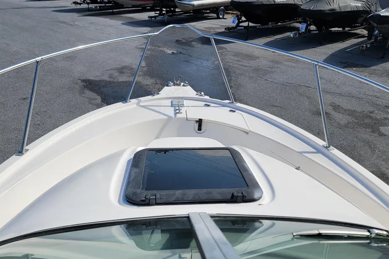 Slide: The Image of 2003 Trophy 2002 Walkaround boat bow view in a marina setting. - 9