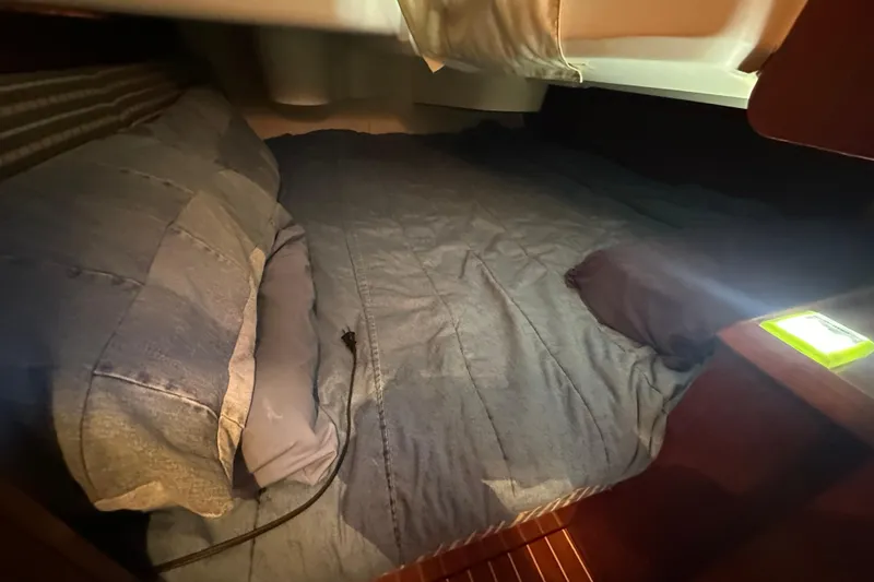 Slide: The Image of Cozy cabin bed in 2004 Jeanneau Sun Odyssey 35 sailboat interior. - 19