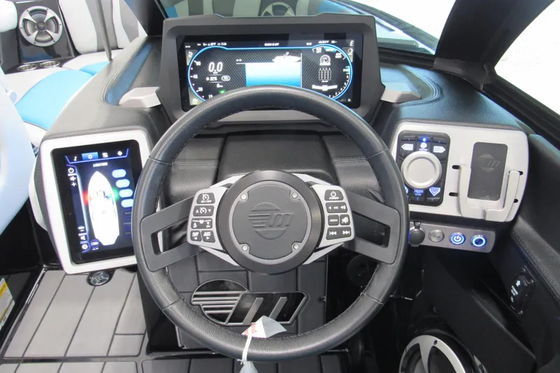 Slide: The Image of 2021 Malibu Wakesetter 24 MXZ dashboard with advanced controls and digital displays. - 8