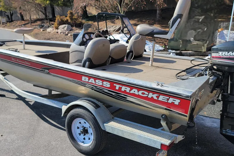 Slide: The Image of 2003 Tracker Pro Team 175 bass boat on trailer, parked outdoors. - 4