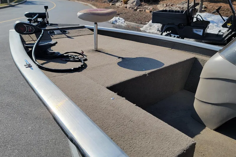 Slide: The Image of 2003 Tracker Pro Team 175 boat deck with seat and trolling motor. - 6