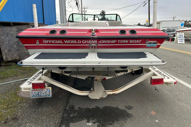 Slide: The Image of 1988 Supra Comp boat, red and white, labeled "Official World Championship Tow Boat." - 2