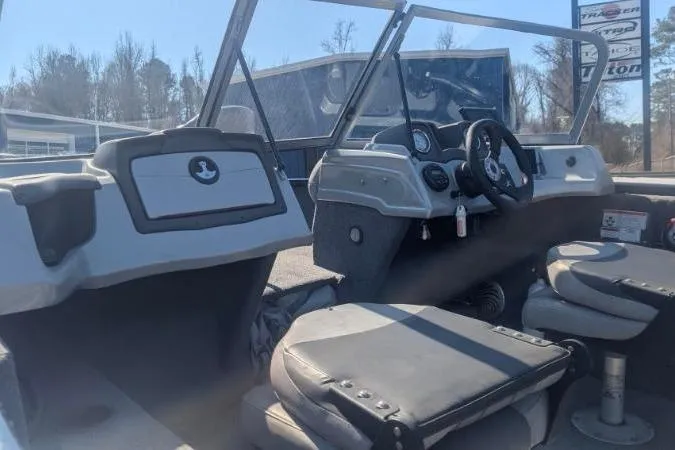 Slide: The Image of 2017 Tracker Pro Guide V-175 Combo boat interior with seating and dashboard. - 8