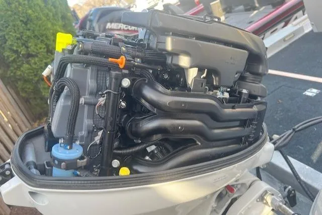 Slide: The Image of 1985 Grumman Outlaw engine close-up, showcasing intricate mechanical components and wiring. - 5