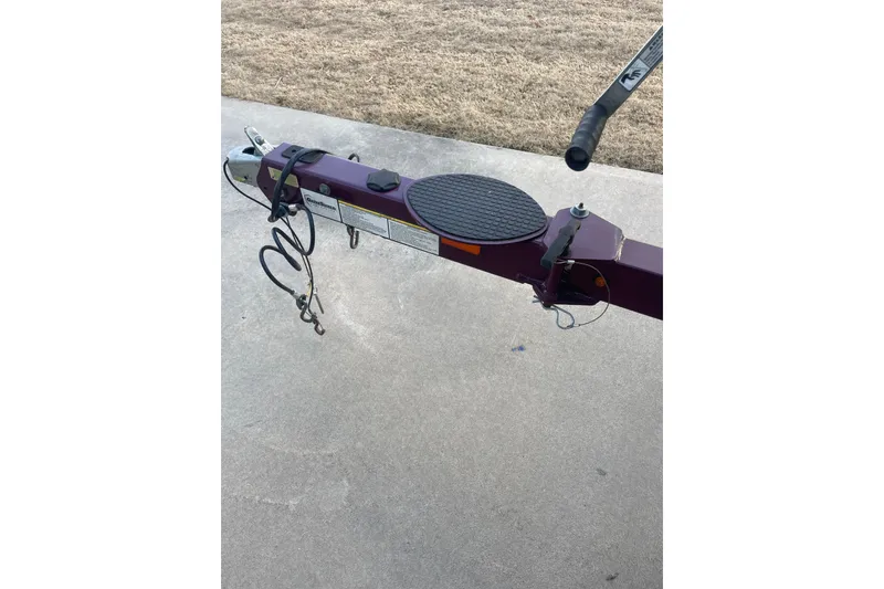 Slide: The Image of Trailer hitch of a 2016 Nitro Z-7 Sport boat on concrete surface. - 8
