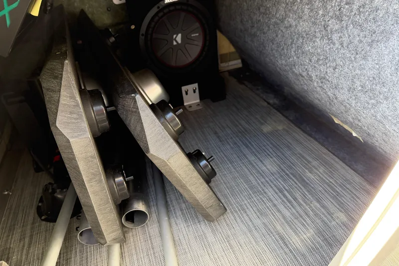 Slide: The Image of Storage compartment of 2021 Bennington QX 25 QXFBA with audio equipment and accessories. - 18