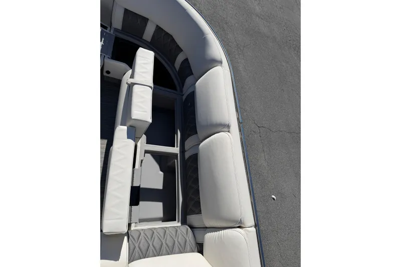 Slide: The Image of 2021 Bennington QX 25 QXFBA boat interior with white cushioned seating. - 20