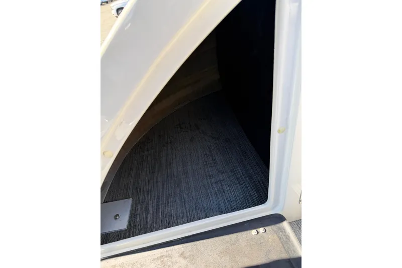 Slide: The Image of Interior view of 2021 Bennington QX 25 QXFBA boat storage compartment. - 22