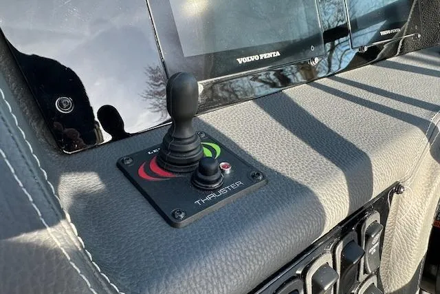 Slide: The Image of Joystick control on 2023 Regal 2800 Bowrider boat dashboard with Volvo Penta display. - 16