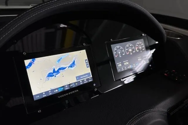 Slide: The Image of 2023 Regal 2800 Bowrider dashboard with navigation and control screens. - 17