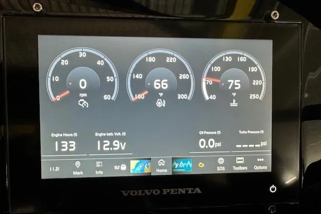 Slide: The Image of Dashboard of 2023 Regal 2800 Bowrider showing engine metrics and Volvo Penta display. - 18