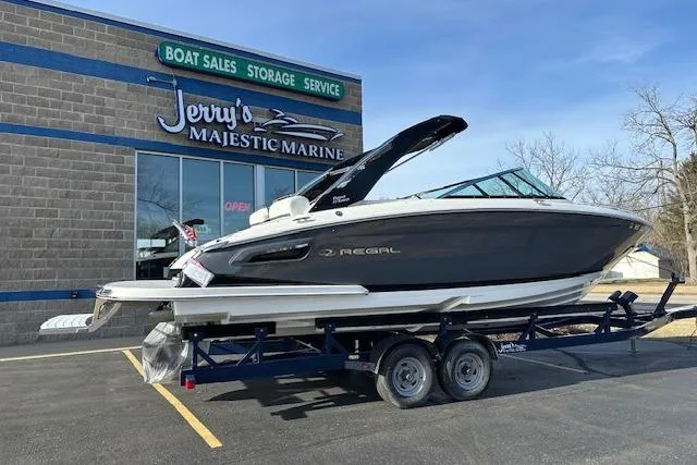 Slide: The Image of 2023 Regal 2800 Bowrider boat on trailer at Jerry's Majestic Marine dealership. - 2
