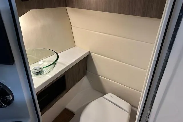 Slide: The Image of 2023 Regal 2800 Bowrider interior bathroom with modern sink and toilet. - 21