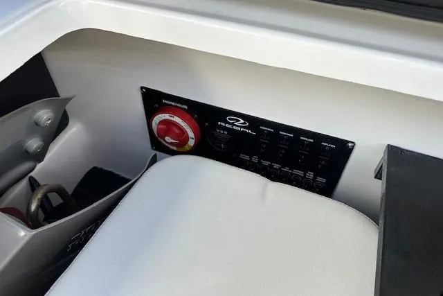 Slide: The Image of 2023 Regal 2800 Bowrider control panel with switches and seating detail. - 24