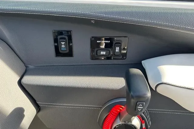 Slide: The Image of 2023 Regal 2800 Bowrider interior controls and throttle lever detail. - 26