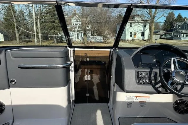 Slide: The Image of 2023 Regal 2800 Bowrider cockpit with steering wheel and control panel, showcasing modern design. - 27