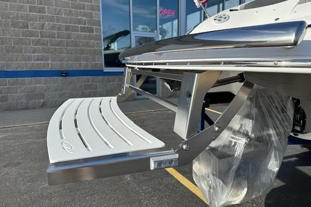 Slide: The Image of 2023 Regal 2800 Bowrider swim platform, stainless steel and white finish, outdoor display. - 8