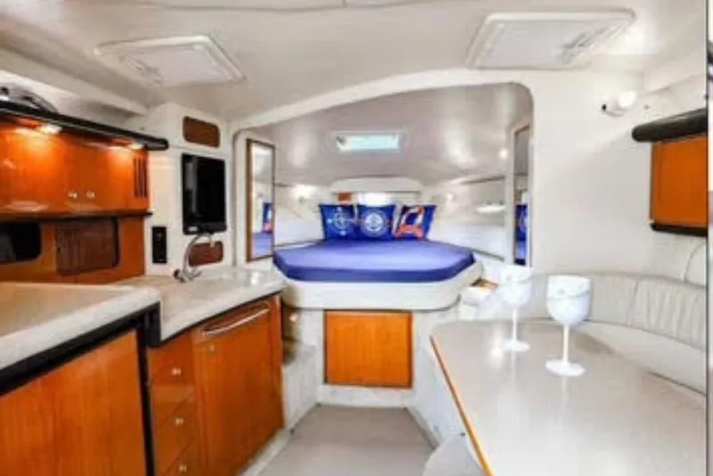 Slide: The Image of Interior of 2000 Sea Ray 340 Sundancer yacht with cozy cabin and modern amenities. - 5