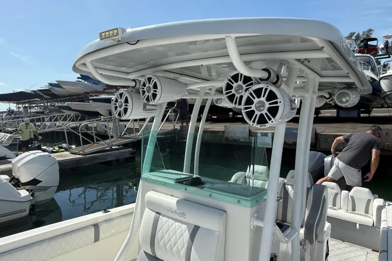 Slide: The Image of 2001 Palmetto Custom 36 boat with speakers, docked at marina under clear sky. - 12