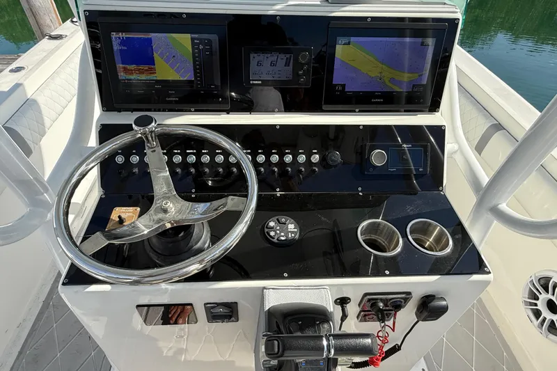 Slide: The Image of Control console of a 2001 Palmetto Custom 36 boat. - 13