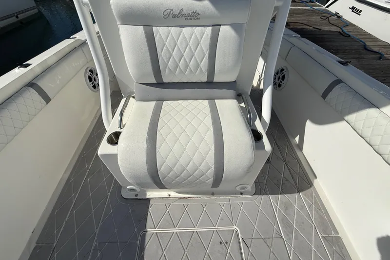 Slide: The Image of 2001 Palmetto Custom 36 boat seat with quilted upholstery and cup holders. - 15