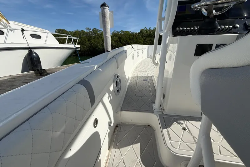 Slide: The Image of 2001 Palmetto Custom 36 boat interior with steering console and cushioned seating. - 17