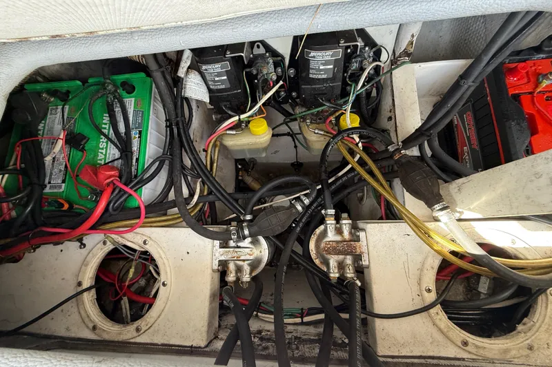 Slide: The Image of Engine compartment of a 2001 Palmetto Custom 36 boat with batteries and wiring. - 21