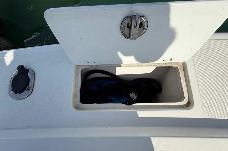 Slide: The Image of Open storage compartment on a 2001 Palmetto Custom 36 boat. - 27